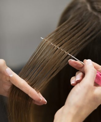 woman-getting-her-hair-cut-beauty-salon