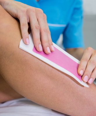 Woman getting her leg hair removed